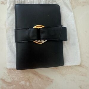Chic Cartier Black Address Book with Gold Ring Detail